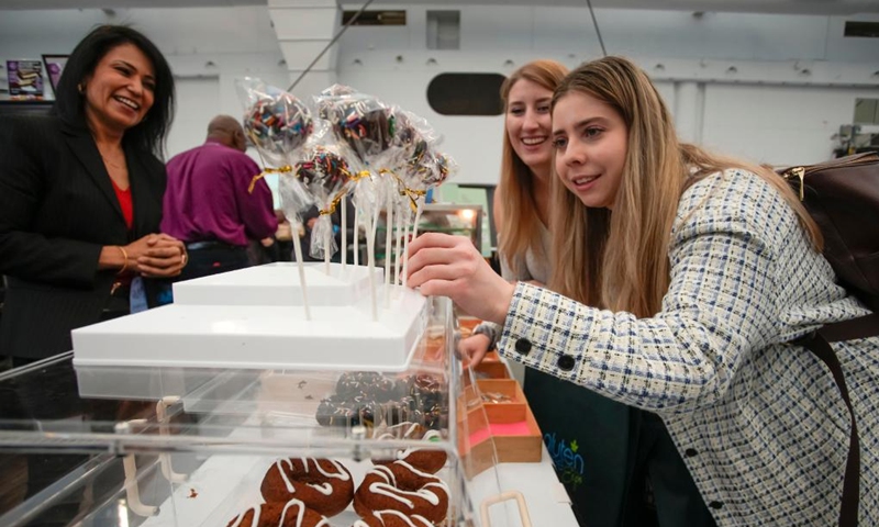 People view gluten-free products at the Gluten Free Expo in Vancouver, British Columbia, Canada, on Jan. 15, 2023. (Photo by Liang Sen/Xinhua)