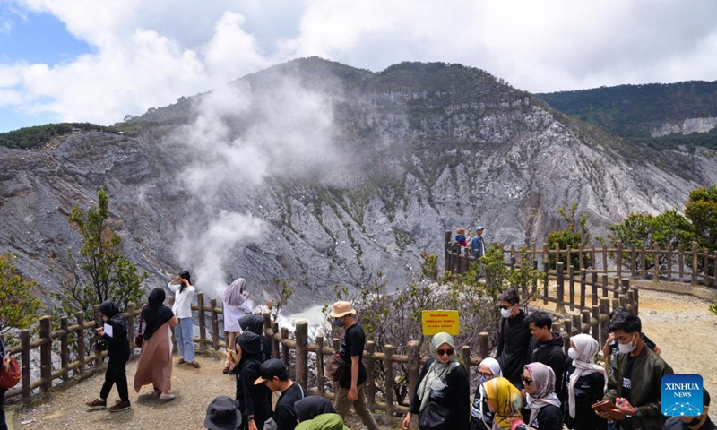 People visit Tangkuban Parahu, a volcano near the city of Bandung, Indonesia on Jan. 22, 2023. The Tangkuban Perahu volcano has attracted many visitors during the Spring Festival holiday in Indonesia. The Chinese Lunar New Year, or Spring Festival, falls on Sunday. (Xinhua/Xu Qin)