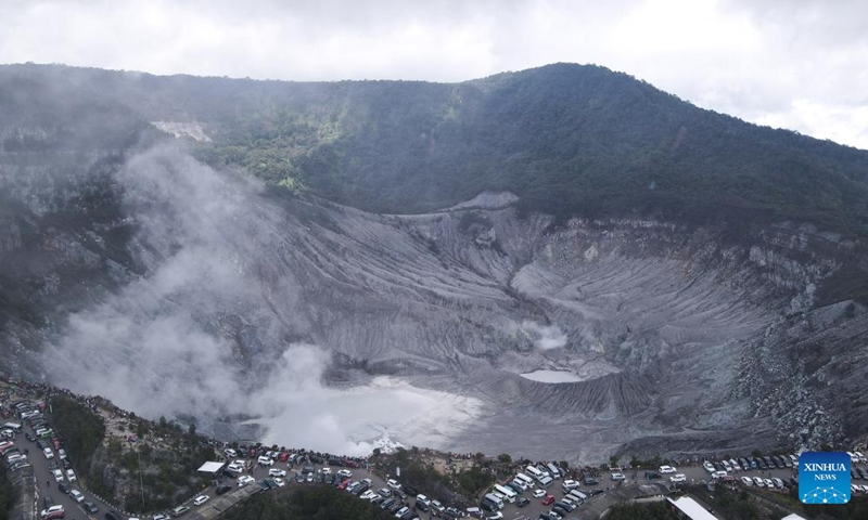 This aerial photo taken on Jan. 22, 2023 shows the crater of Tangkuban Perahu, a volcano near the city of Bandung, Indonesia. The Tangkuban Perahu volcano has attracted many visitors during the Spring Festival holiday in Indonesia. The Chinese Lunar New Year, or Spring Festival, falls on Sunday. (Xinhua/Xu Qin)