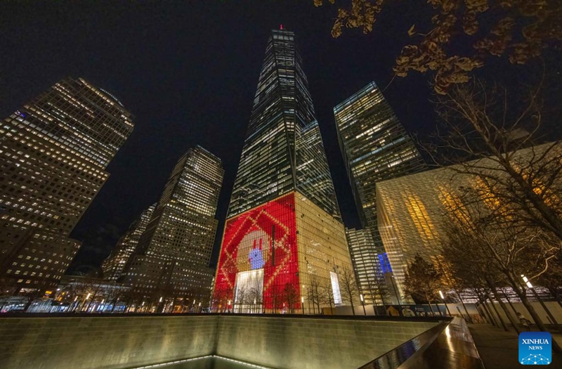 This photo taken on Jan. 20, 2023 shows One World Trade Center displaying patterns for Chinese Lunar New Year, in New York, the United States. (Photo by Winston Zhou/Xinhua)