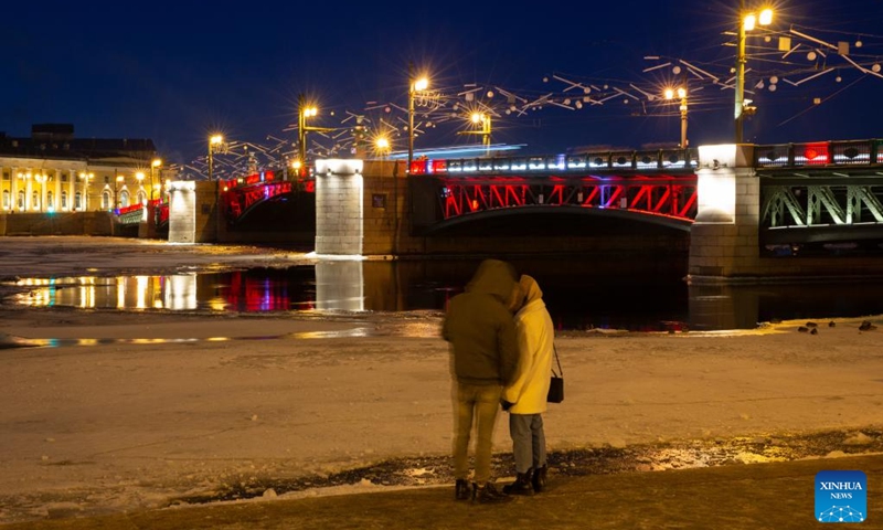 This photo taken on Jan. 21, 2023 shows the Palace Bridge illuminated in red to celebrate the Chinese New Year in St. Petersburg, Russia. (Photo by Irina Motina/Xinhua)