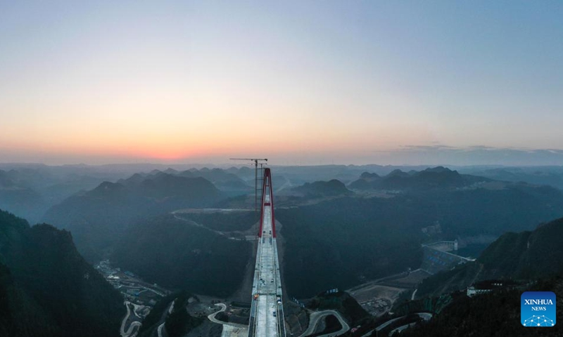 This aerial photo taken on Jan. 29, 2023 shows the Longlihe Bridge in Longli County, southwest China's Guizhou Province. The 1,260-meter-long bridge is under construction.(Photo: Xinhua)