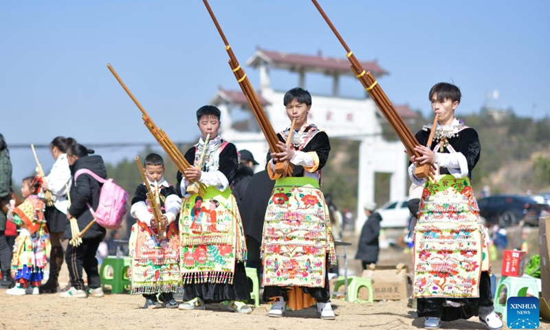 People of Miao ethnic group in traditional costumes participate in an activity called Tiaoyue in Zhongpai Village of Longli County, southwest China's Guizhou Province, Jan. 29, 2023. Tiaoyue, literally meaning dancing in the moonlight, originated from an ancient custom traditionally practiced for auspiciousness praying and new year celebration among the Miao ethnic group, is also an occasion for the youth to express love and find prospective mates.(Photo: Xinhua)