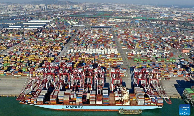 This aerial photo taken on Jan. 27, 2023 shows a container ship at the Qianwan Container Terminal of Qingdao Port in east China's Shandong Province.(Photo: Xinhua)