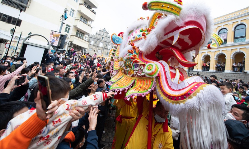 Actors perform the dragon dance in front of the Ruins of St. Paul's in south China's Macao on Jan. 22, 2023.(Photo: Xinhua)