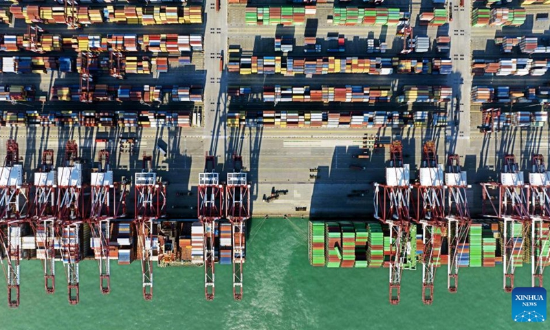 This aerial photo taken on Jan. 27, 2023 shows container ships at the Qianwan Container Terminal of Qingdao Port in east China's Shandong Province.(Photo: Xinhua)