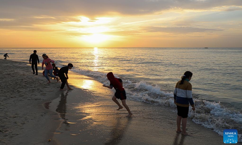 People have fun at sunset on a beach of the Mediterranean Sea in Gaza City, on Jan. 27, 2023.(Photo: Xinhua)