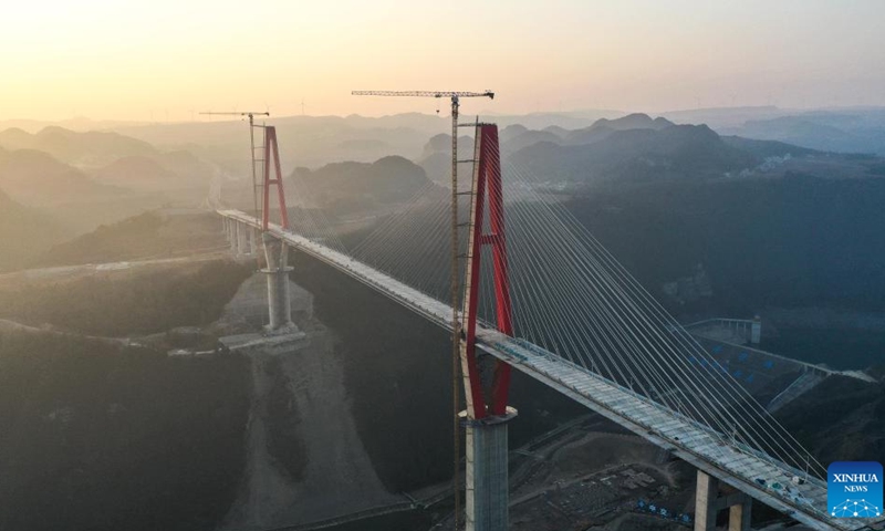 This aerial photo taken on Jan. 29, 2023 shows the Longlihe Bridge in Longli County, southwest China's Guizhou Province. The 1,260-meter-long bridge is under construction.(Photo: Xinhua)