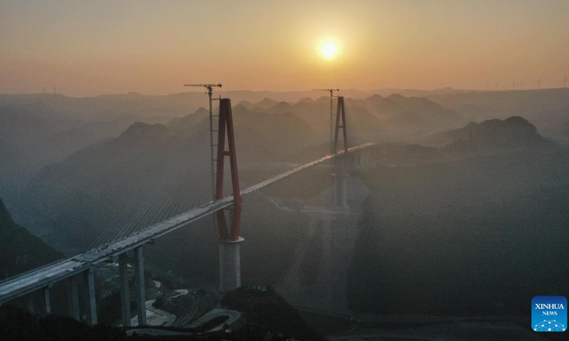 This aerial photo taken on Jan. 29, 2023 shows the Longlihe Bridge in Longli County, southwest China's Guizhou Province. The 1,260-meter-long bridge is under construction.(Photo: Xinhua)