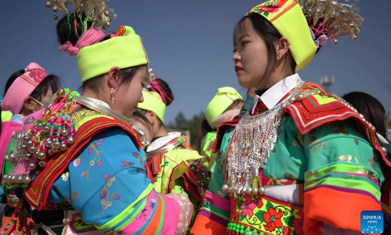 People of Miao ethnic group in traditional costumes participate in an activity called Tiaoyue in Zhongpai Village of Longli County, southwest China's Guizhou Province, Jan. 29, 2023. Tiaoyue, literally meaning dancing in the moonlight, originated from an ancient custom traditionally practiced for auspiciousness praying and new year celebration among the Miao ethnic group, is also an occasion for the youth to express love and find prospective mates.(Photo: Xinhua)