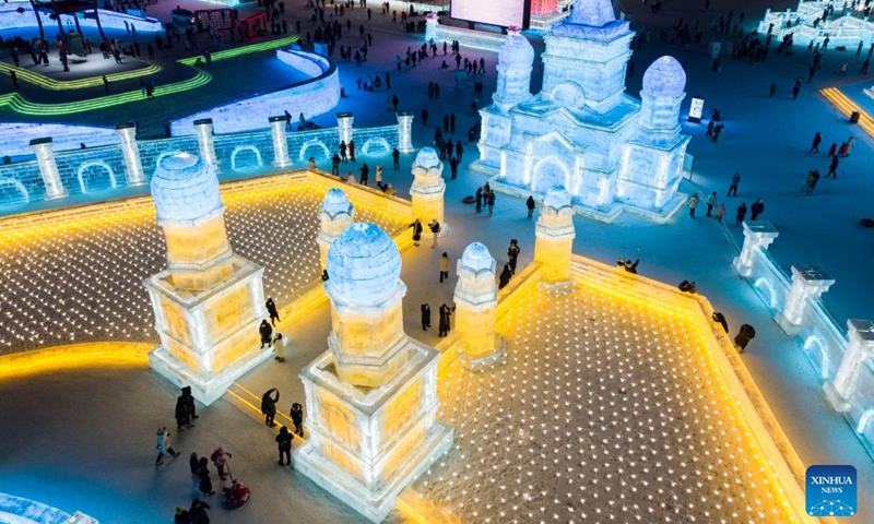 This aerial photo shows people visiting the Ice-Snow World theme park in Harbin, northeast China's Heilongjiang Province, Feb. 1, 2023. Harbin, known as China's ice city, has been attracting many tourists in winter tourism season.(Photo: Xinhua)