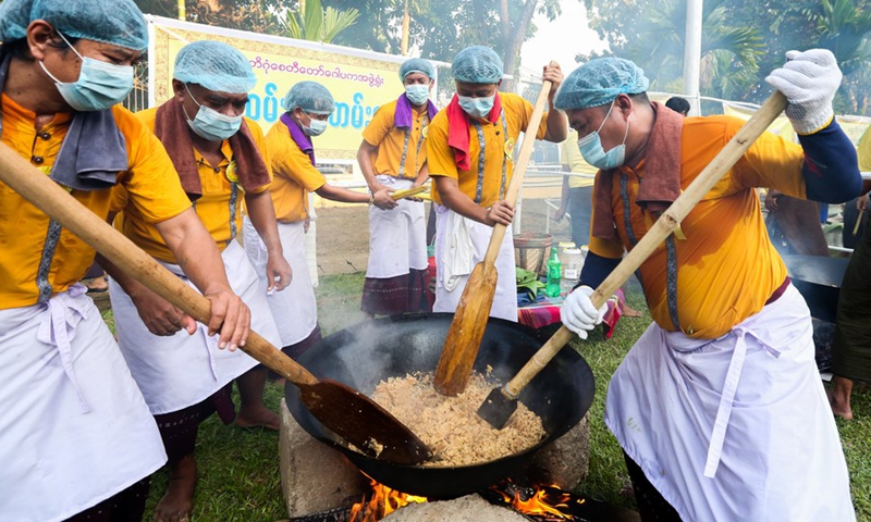 People participate in a traditional Htamane (sticky rice) making competition at the Shwedagon Pagoda in Yangon, Myanmar, Feb. 3, 2023.(Photo: Xinhua)