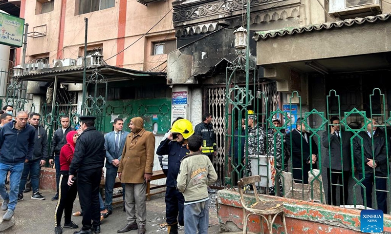 People gather outside a hospital where a fire broke out in Cairo, Egypt, on Feb. 1, 2023. At least three people were killed and 32 others wounded in a fire that broke out Wednesday at the charitable hospital in Cairo, said the Egyptian Health Ministry in a statement.(Photo: Xinhua)