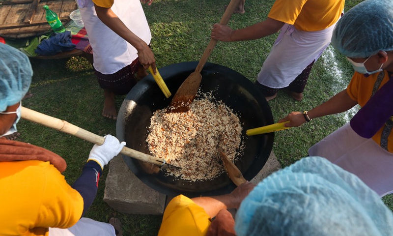 People participate in a traditional Htamane (sticky rice) making competition at the Shwedagon Pagoda in Yangon, Myanmar, Feb. 3, 2023.(Photo: Xinhua)