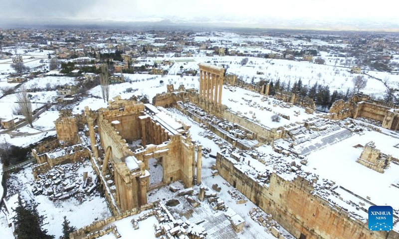 This photo taken on Feb. 7, 2023 shows the snow scenery of Roman ruins in the city of Baalbek, Lebanon. (Photo by Taher Abu Hamdan/Xinhua)