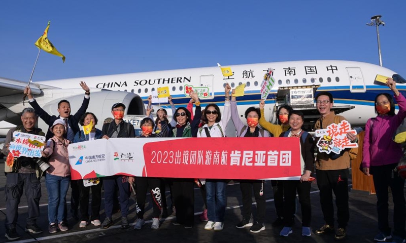 Chinese tourists pose for a photo at Jomo Kenyatta International Airport in Nairobi, Kenya, Feb. 11, 2023. A flight carrying 40 Chinese group tourists arrived at Jomo Kenyatta International Airport in Nairobi on Saturday. This is the first outbound tour group from China to Kenya since China resumed outbound group travel to 20 countries.(Photo: Xinhua)