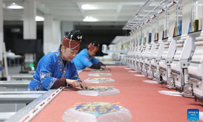 Staff members work at an embroidery workshop of an industrial park in Shibing County of Qiandongnan Miao and Dong Autonomous Prefecture, southwest China's Guizhou Province, Feb. 13, 2023.(Photo: Xinhua)