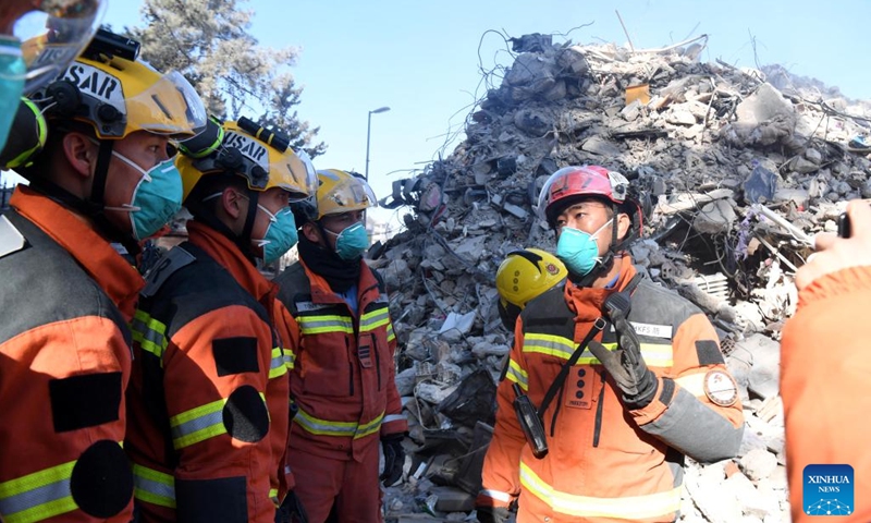 A joint rescue group encompassing members of China Search and Rescue Team and a search and rescue team from the Hong Kong Special Administrative Region (HKSAR) carry out rescue operation among earthquake debris in Antakya, southern province of Hatay, Türkiye, Feb. 14, 2023. China has offered an array of rescue teams and vital items to Türkiye since massive earthquakes and aftershocks jolted the country last week, in an effort to help search for survivors trapped under the rubble.(Photo: Xinhua)