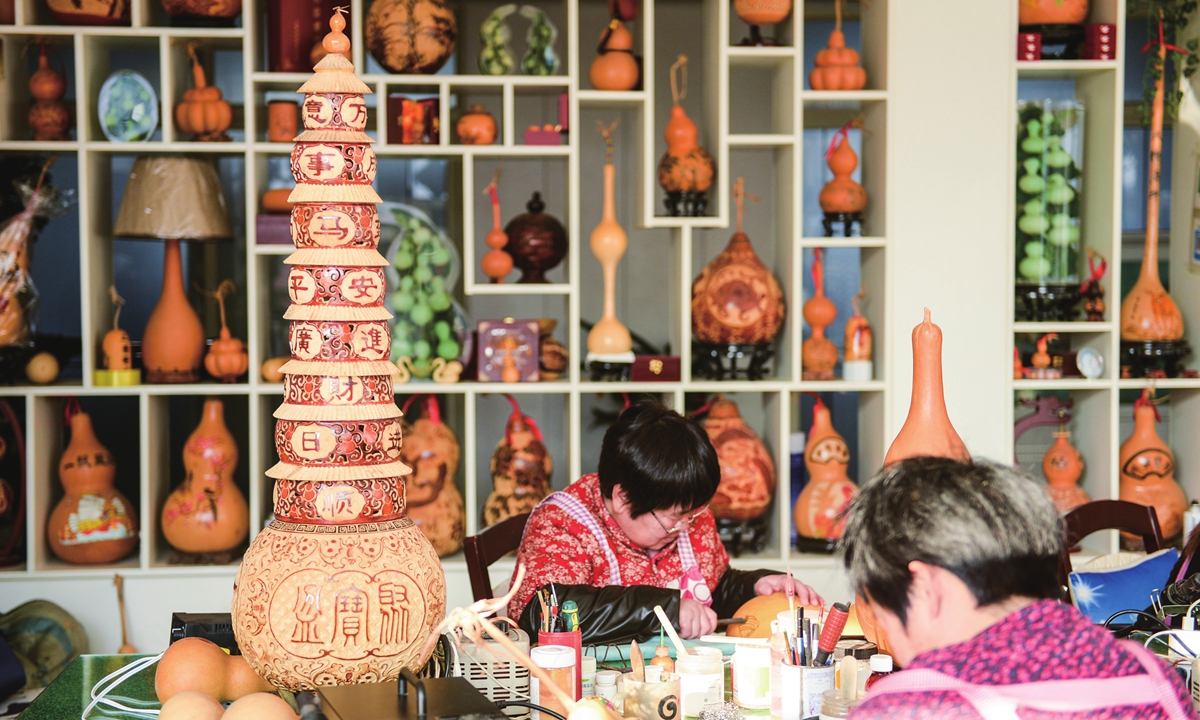 Villagers turn gourds into art in Luxi village of Liaocheng City, East China's Shandong Province on February 15, 2023. The gourd industry has become a strong driving force for rural revitalization, with a planting area of more than 1,200 mu (80 hectares) and an annual output value of nearly 300 million yuan ($43.86 million). Photo: VCG