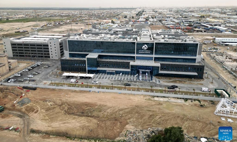 This aerial photo taken on Feb. 15, 2023 shows the main building of the Kuwait Health Assurance Hospital in Jahra Governorate, Kuwait. The soft opening ceremony of Kuwait Health Assurance Hospital in Jahra Governorate was held on Wednesday.The Kuwait Health Assurance Hospitals project undertaken by Metallurgical Corporation of China Ltd exclusively provides medical insurance services to foreigners.(Photo: Xinhua)