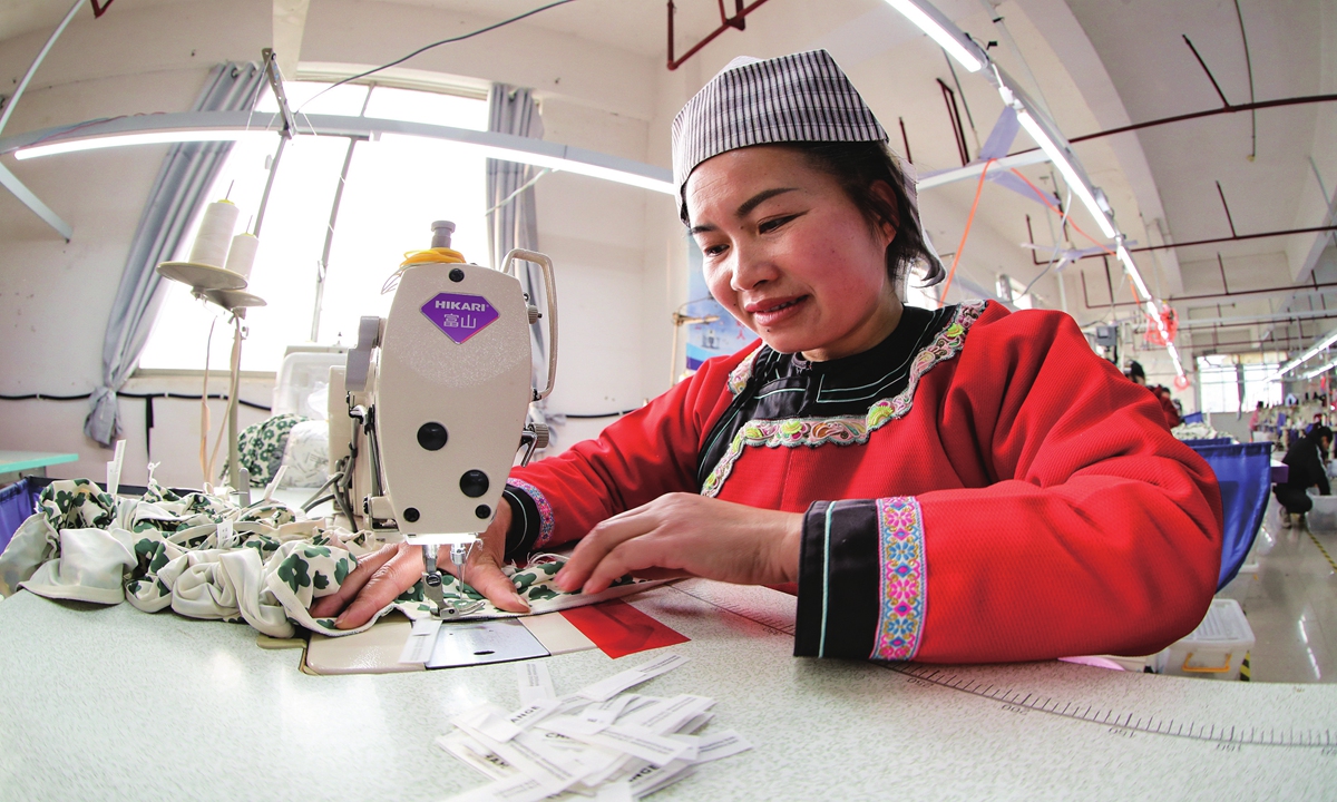 An employee makes underwear for export orders in Qiandongnan Miao and Dong Autonomous Prefecture, Southwest China's Guizhou Province on February 20, 2023. Local workers are ramping up efforts to produce underwear for shipment to Europe and the US.Photo: cnsphoto