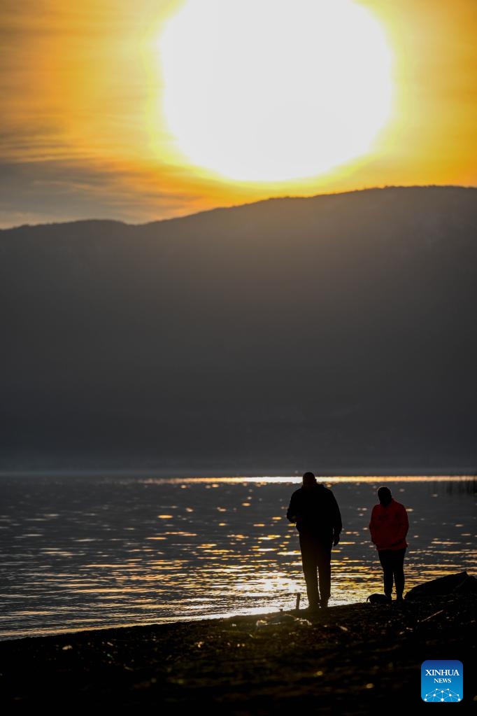 People walk on the shore of Ohrid Lake in Struga, North Macedonia, Feb. 18, 2023. Photo: Xinhua