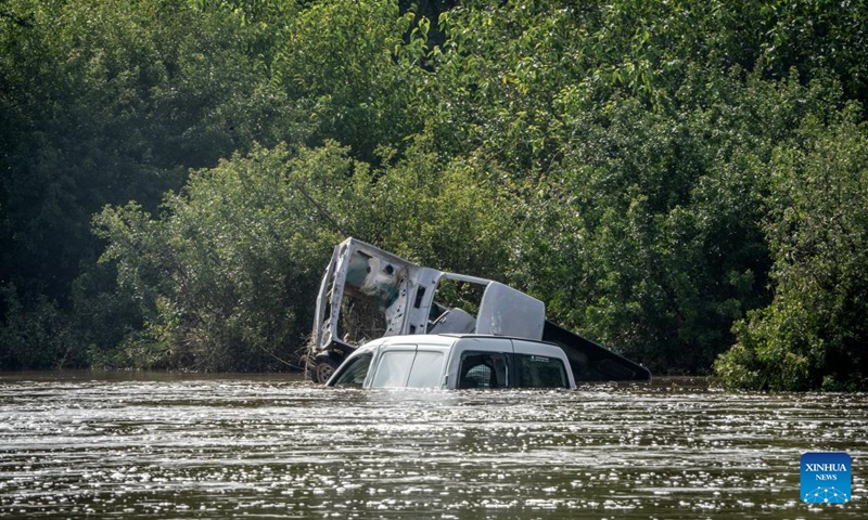 Vehicles are submerged in water in Lochvaal, South Africa, Feb. 19, 2023. The Vaal dam exceeded its maximum capacity due to heavy rainfall and caused floods in the Vaal River.(Photo: Xinhua)