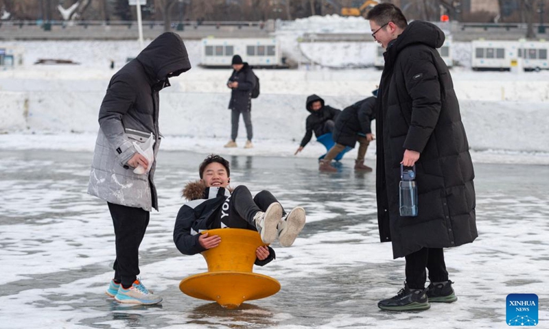 Tourists have fun at Harbin Songhua River Ice and Snow Carnival in Harbin, northeast China's Heilongjiang Province, Feb. 22, 2023. The theme park closed on Wednesday.(Photo: Xinhua)