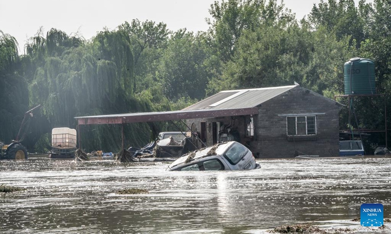 A vehicle is submerged in water in Lochvaal, South Africa, Feb. 19, 2023. The Vaal dam exceeded its maximum capacity due to heavy rainfall and caused floods in the Vaal River.(Photo: Xinhua)