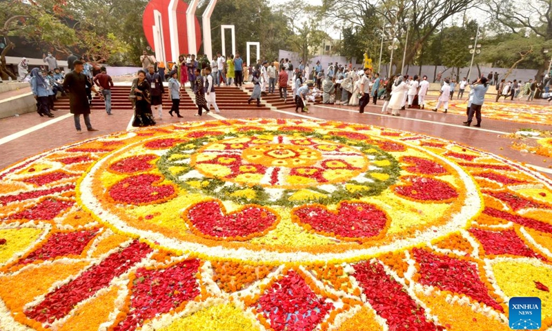 This photo taken on Feb. 21, 2023 shows flower-bedecked altar of the Central Shaheed Minar, a solemn and iconic monument, in Dhaka, Bangladesh. Hundreds of thousands of people in Bangladeshi capital Dhaka Tuesday paid tributes to the country's language movement activists who sacrificed their lives on the day in 1952.(Photo: Xinhua)