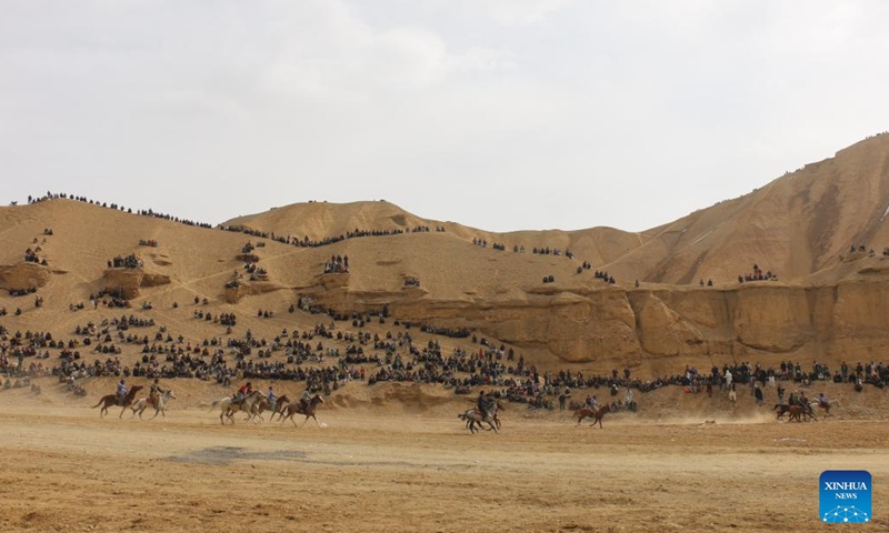 Afghan horse riders compete for a goat in a Buzkashi game in Bamyan province, Afghanistan, Feb. 19, 2023. Buzkashi is the Afghan version of a game a bit like polo, played across all of Central Asia. Two teams of horsemen compete to grab a goat carcass and carry it through a goal.(Photo: Xinhua)