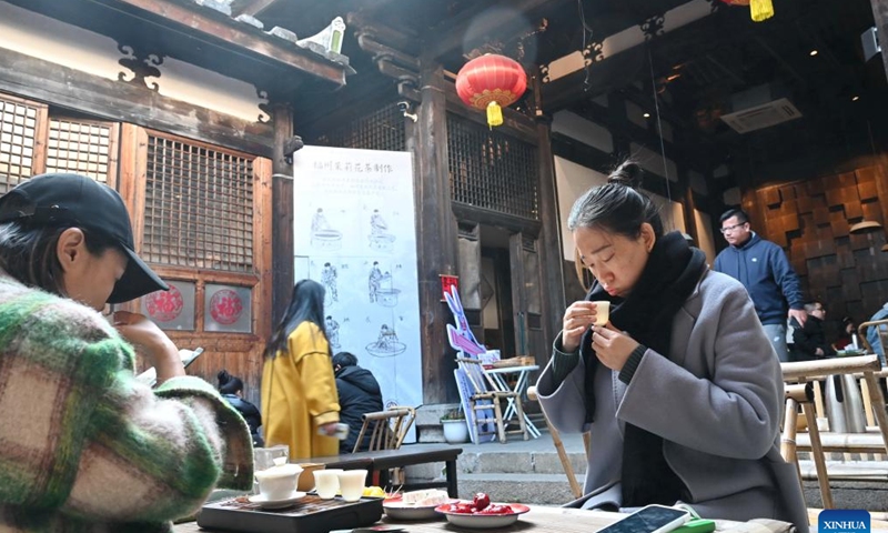 People drink tea at a tea house in the Shangxiahang traditional block in Fuzhou, southeast China's Fujian Province, Feb. 26, 2023.

The time-honored tea culture has contributed to the thriving of tea houses in Fuzhou. (Xinhua/Lin Shanchuan)