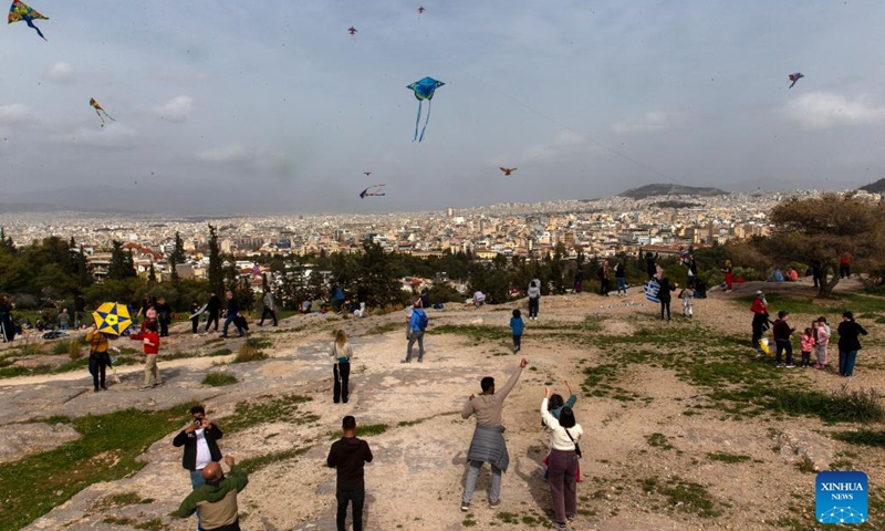 People fly kites on the occasion of Clean Monday at Filopappou Hill in Athens, Greece, on Feb. 27, 2023.(Photo: Xinhua)