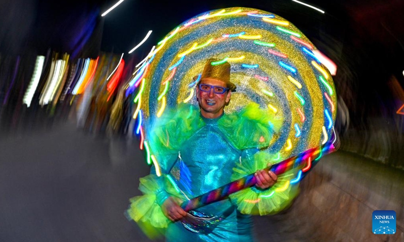 A costumed reveler performs in a carnival procession in Strumica, North Macedonia, on Feb. 25, 2023. (Photo by Tomislav Georgiev/Xinhua)