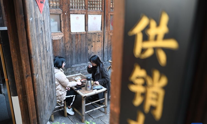 People drink tea at a tea house in the Shangxiahang traditional block in Fuzhou, southeast China's Fujian Province, Feb. 26, 2023.

The time-honored tea culture has contributed to the thriving of tea houses in Fuzhou. (Xinhua/Lin Shanchuan)