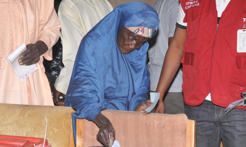 A woman casts her vote at a polling station in Daura, Katsina state, Nigeria, on Feb. 25, 2023. Nigeria's presidential and parliamentary elections kicked off Saturday as voters went to the polls nationwide to elect a new president and members of the national assembly. (News Agency of Nigeria/Handout via Xinhua)

