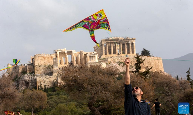 A man flies a kite on the occasion of Clean Monday at Filopappou Hill in Athens, Greece, on Feb. 27, 2023.(Photo: Xinhua)