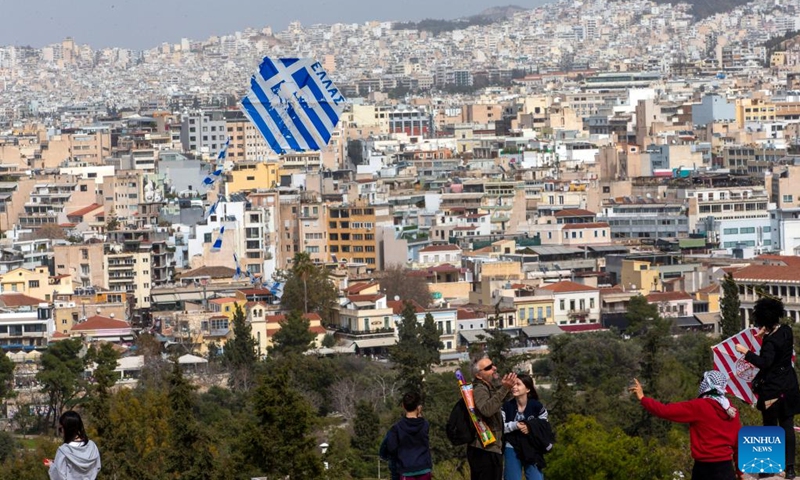 People fly kites on the occasion of Clean Monday at Filopappou Hill in Athens, Greece, on Feb. 27, 2023.(Photo: Xinhua)