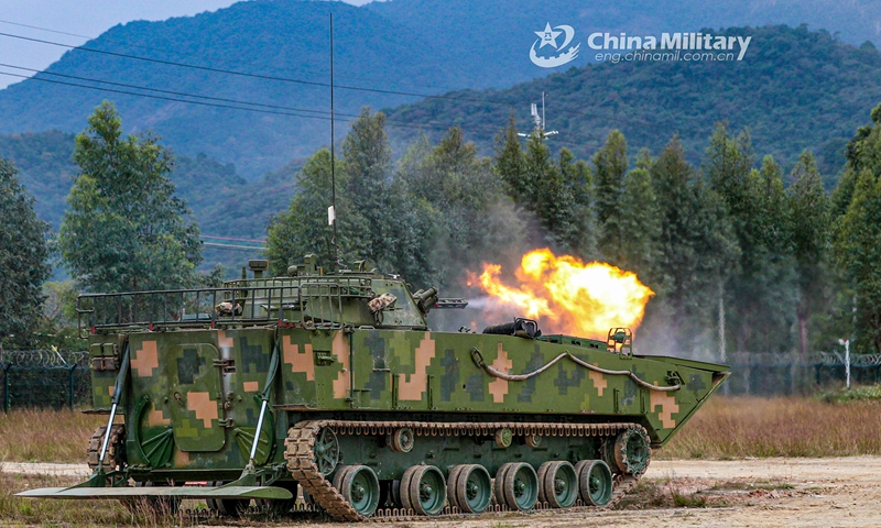 An amphibious infantry fighting vehicle attached to the PLA 74th Group Army spits fire at simulated target during a recent live-fire training exercise. (eng.chinamil.com.cn/Photo by Li Bin)