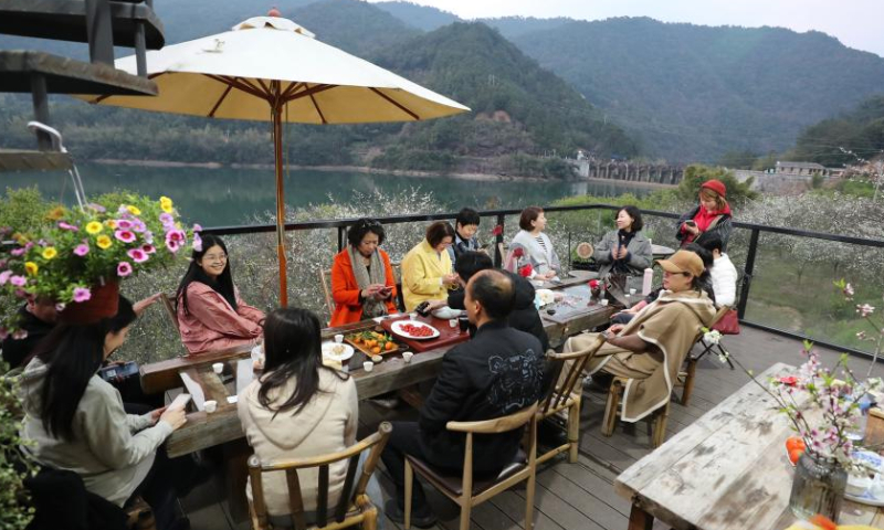 Tourists enjoy themselves at an observation deck at Daxi Village of Yongtai County, southeast China's Fujian Province, Feb. 24, 2023.

Ancient villages in Yongtai County have been attracting many tourists as plum trees are in blossom in early spring. (Xinhua/Jiang Kehong)