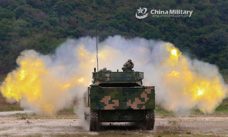 An amphibious armored assault vehicle attached to the PLA 74th Group Army spits fire at simulated target during a recent live-fire training exercise. (eng.chinamil.com.cn/Photo by Li Bin)