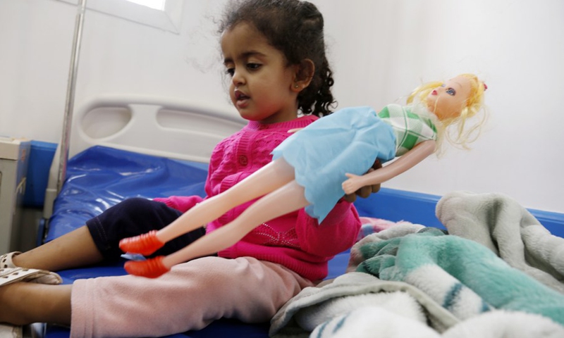 A malnourished Yemeni child holds a doll while receiving medical treatment at a hospital in Sanaa, Yemen, on Feb. 27, 2023.(Photo: Xinhua)