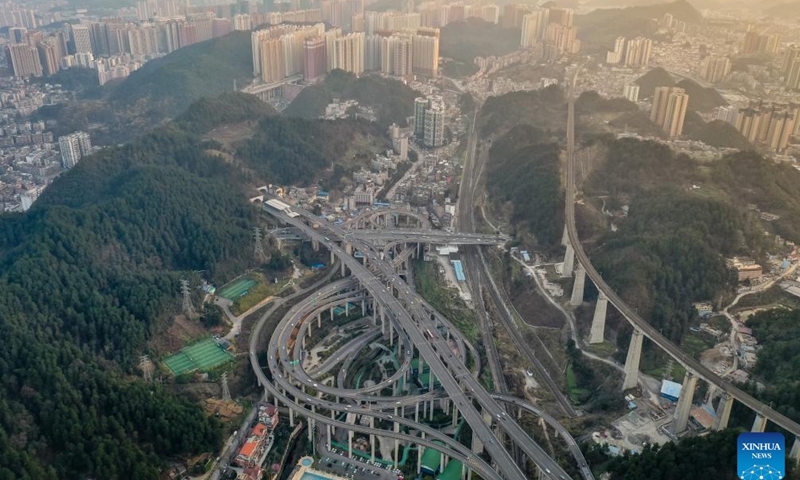 This aerial photo taken on Feb. 25, 2023 shows the Qianchun interchange in Guiyang, southwest China's Guizhou Province. Located in the capital city of Guiyang, the five-layer Qianchun interchange consists of 11 ramps and eight exits and entrances. The largest vertical drop of the interchange reaches 55 meters. (Xinhua/Liu Xu)