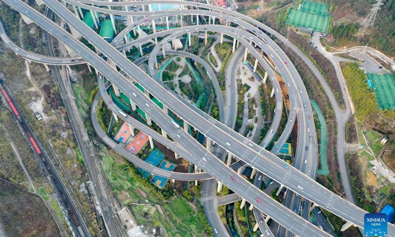 This aerial photo taken on Feb. 25, 2023 shows the Qianchun interchange in Guiyang, southwest China's Guizhou Province. Located in the capital city of Guiyang, the five-layer Qianchun interchange consists of 11 ramps and eight exits and entrances. The largest vertical drop of the interchange reaches 55 meters. (Xinhua/Liu Xu)