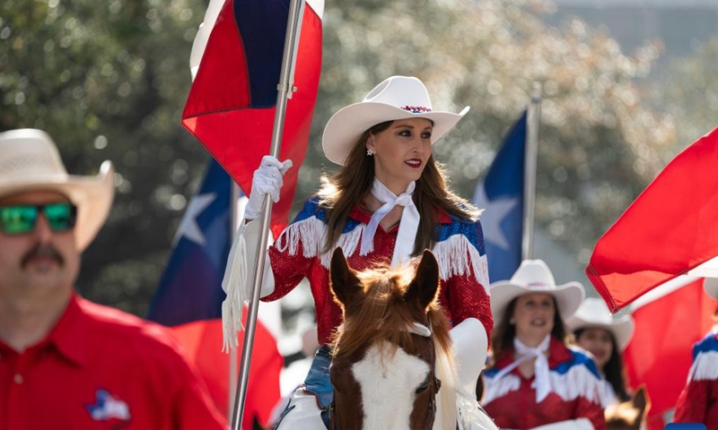 Cowgirls get ready before the 91st Downtown Rodeo Parade in Houston, Texas, the United States, Feb. 25, 2023. (Photo by Chen Chen/Xinhua)