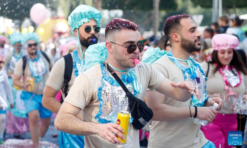 People attend the traditional Limassol Carnival parade in Limassol, in the eastern Mediterranean island of Cyprus, Feb. 26, 2023.(Photo: Xinhua)