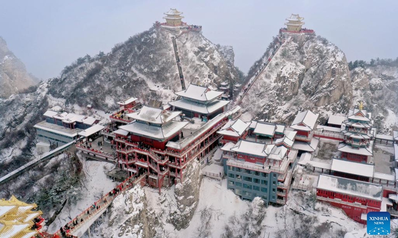 This aerial photo taken on Feb. 23, 2023 shows the scenery of the Laojun Mountain scenic spot in Luanchuan County of Luoyang, central China's Henan Province. Official data showed that the city saw 10.31 million trips in January of 2023, generating 6.28 billion yuan (about 902.44 million U.S. dollars) in revenue, up 746.63 percent and 690.06 percent year on year respectively.(Photo: Xinhua)
