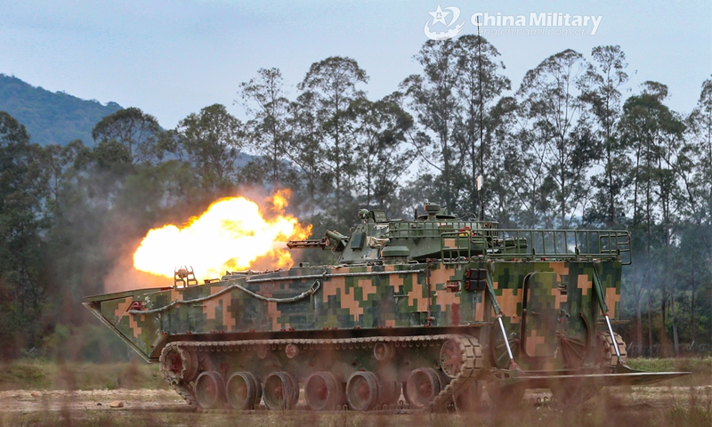 An amphibious infantry fighting vehicle attached to the PLA 74th Group Army spits fire at simulated target during a recent live-fire training exercise. (eng.chinamil.com.cn/Photo by Li Bin)