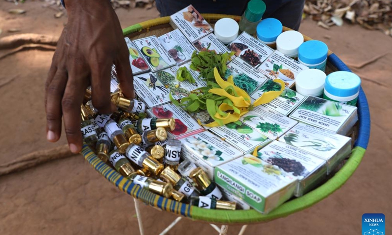 A vendor displays various spice products at a spice farm in Zanzibar, Tanzania, Feb. 24, 2023. Zanzibar is known the world over as the Spice Island. (Xinhua/Dong Jianghui)