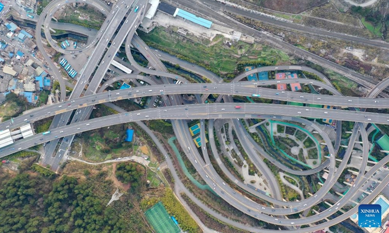 This aerial photo taken on Feb. 25, 2023 shows the Qianchun interchange in Guiyang, southwest China's Guizhou Province. Located in the capital city of Guiyang, the five-layer Qianchun interchange consists of 11 ramps and eight exits and entrances. The largest vertical drop of the interchange reaches 55 meters. (Xinhua/Liu Xu)